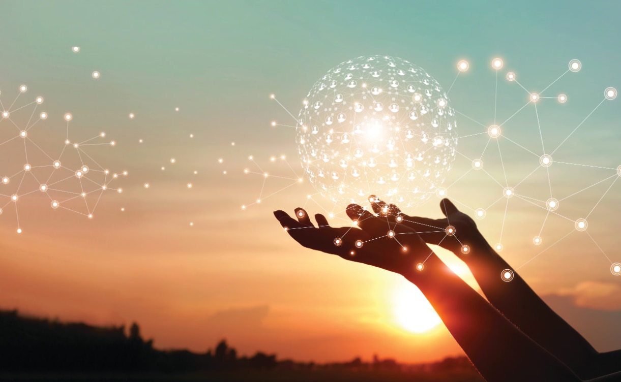 Hands reaching toward a glowing digital network sphere, symbolizing community connection, collaboration, and collective impact.