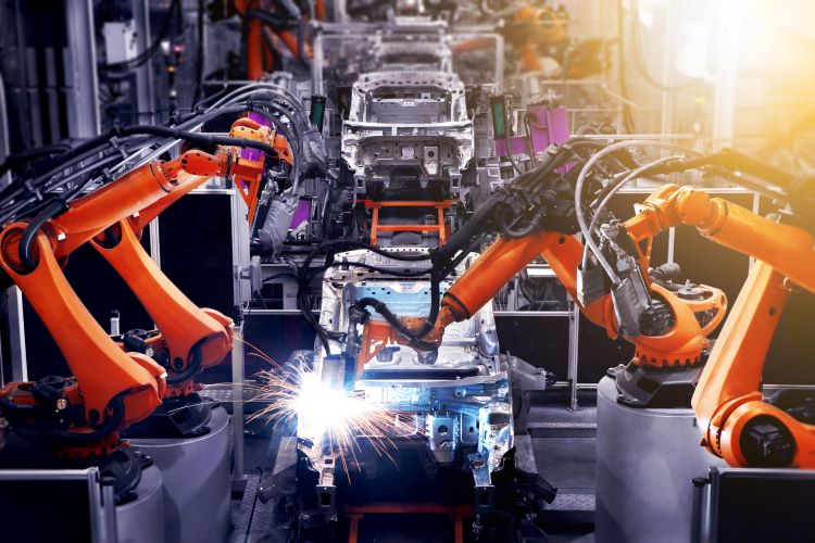 Robots welding on a car body